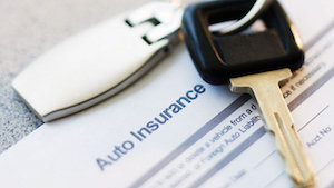 image of insurance policy and key