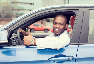 Man in blue car