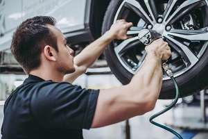 guy working on a car